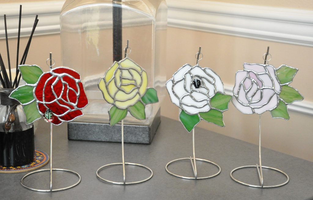 roses - suncatchers with an occasional ladybug